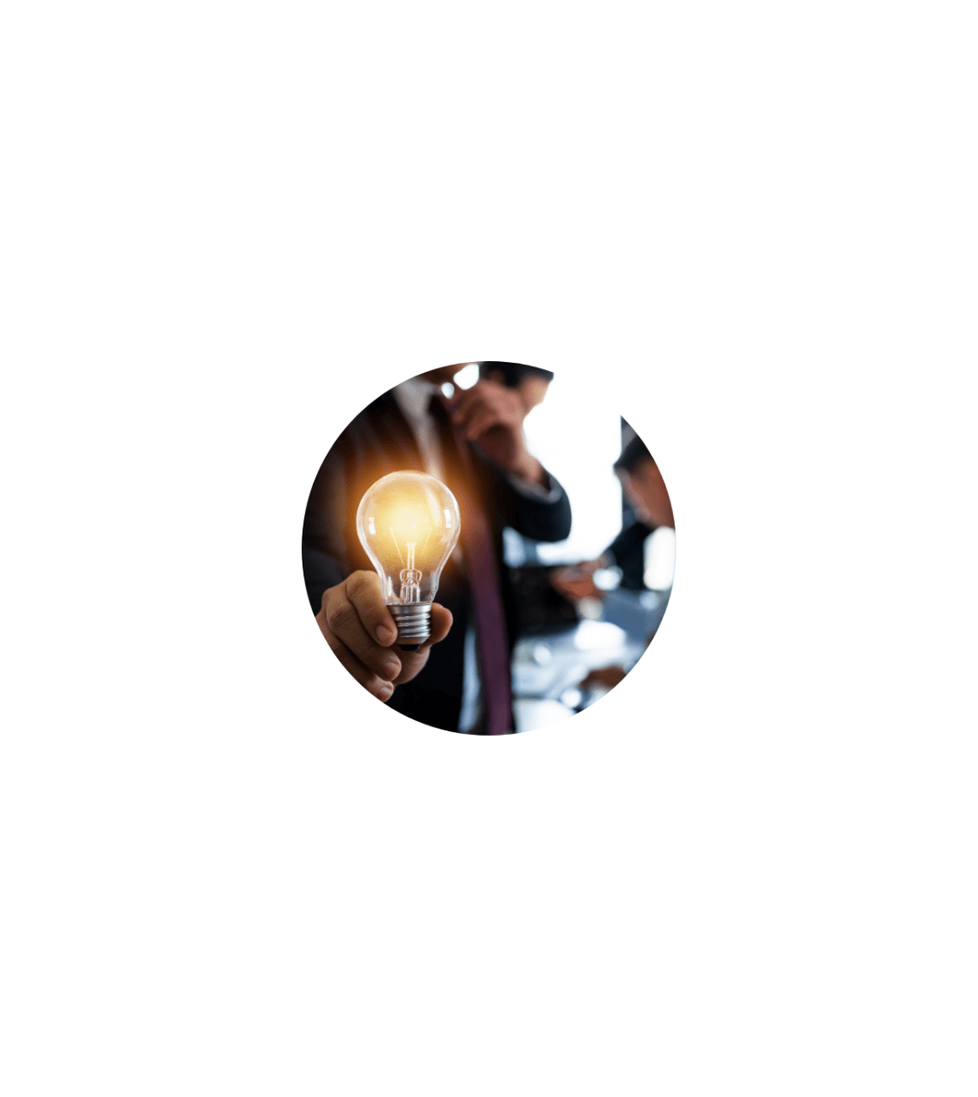 Close-up of a person holding a glowing lightbulb, symbolizing innovation or a new idea in a business setting.