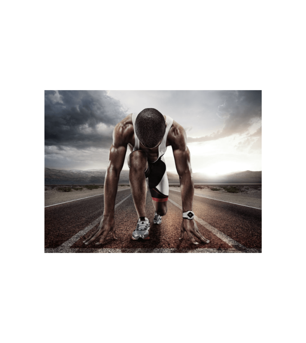 Sprinter in starting position on a track at sunrise, showcasing focus, power, and peak physical performance.